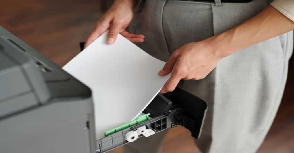 thay bộ kéo giấy máy in